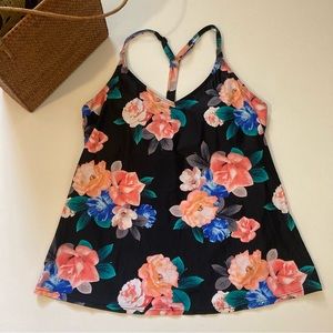 Tankini top featuring tropical flowers on black background